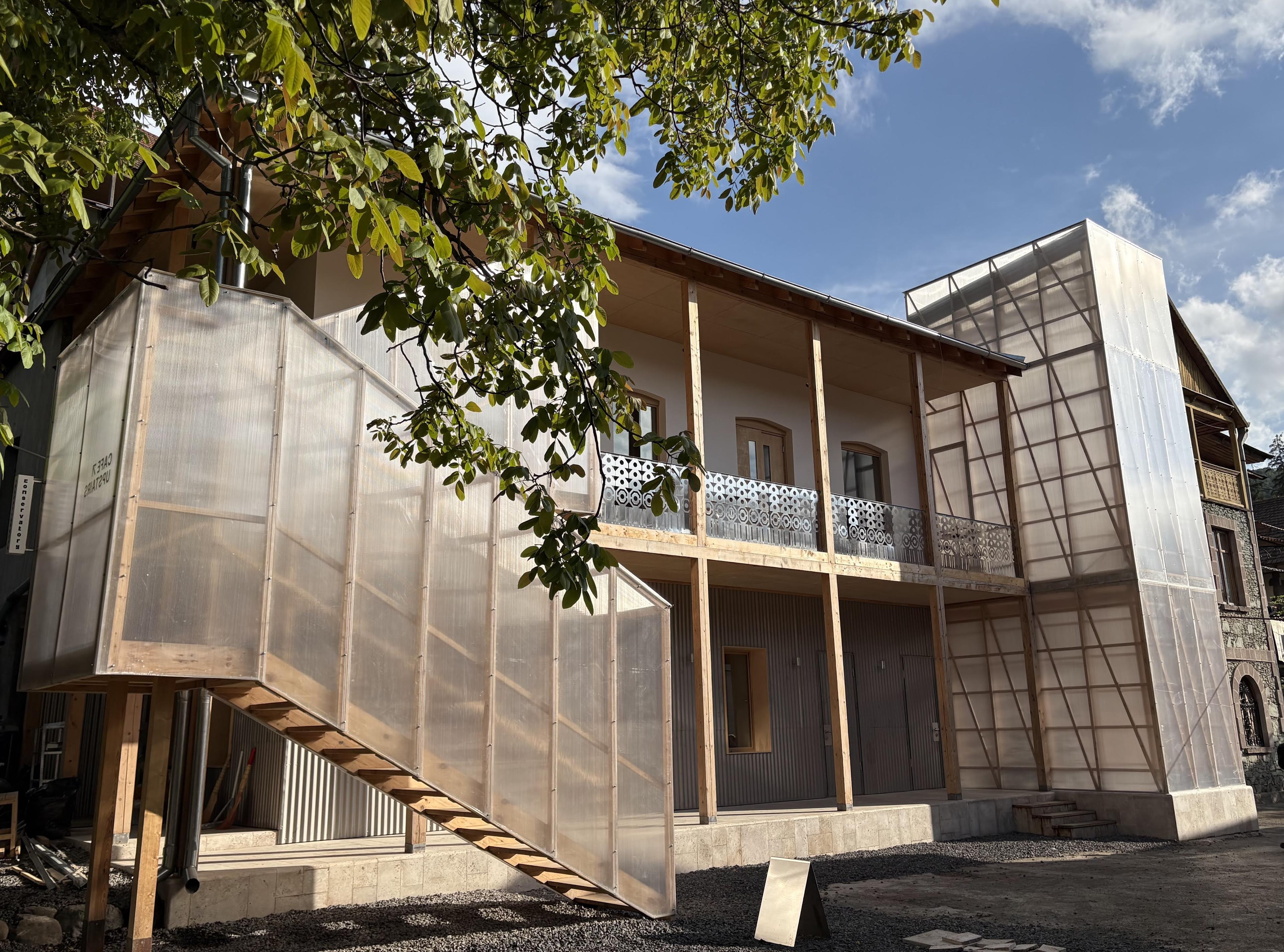The house and the polycarbonate tower, from the courtyard